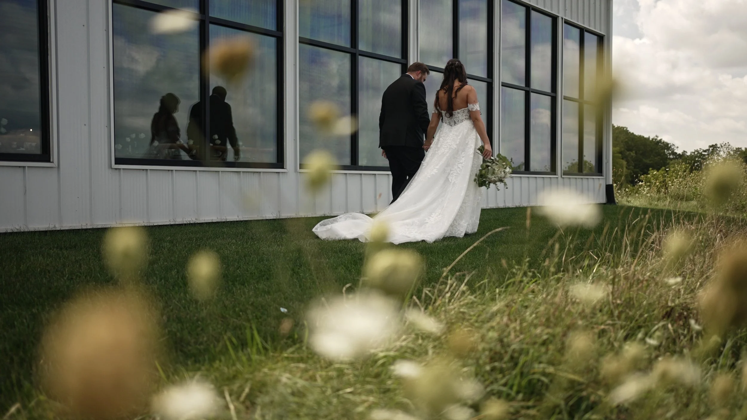 couple walking next to venue_1.15.1.jpg