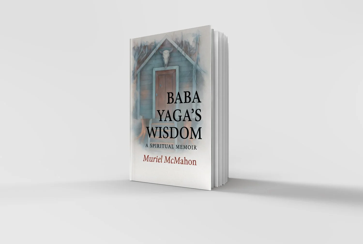 Book titled 'Baba Yaga's Wisdom: A Spiritual Memoir' by Muriel McMahon, featuring a mysterious house with a goat skull on the roof.