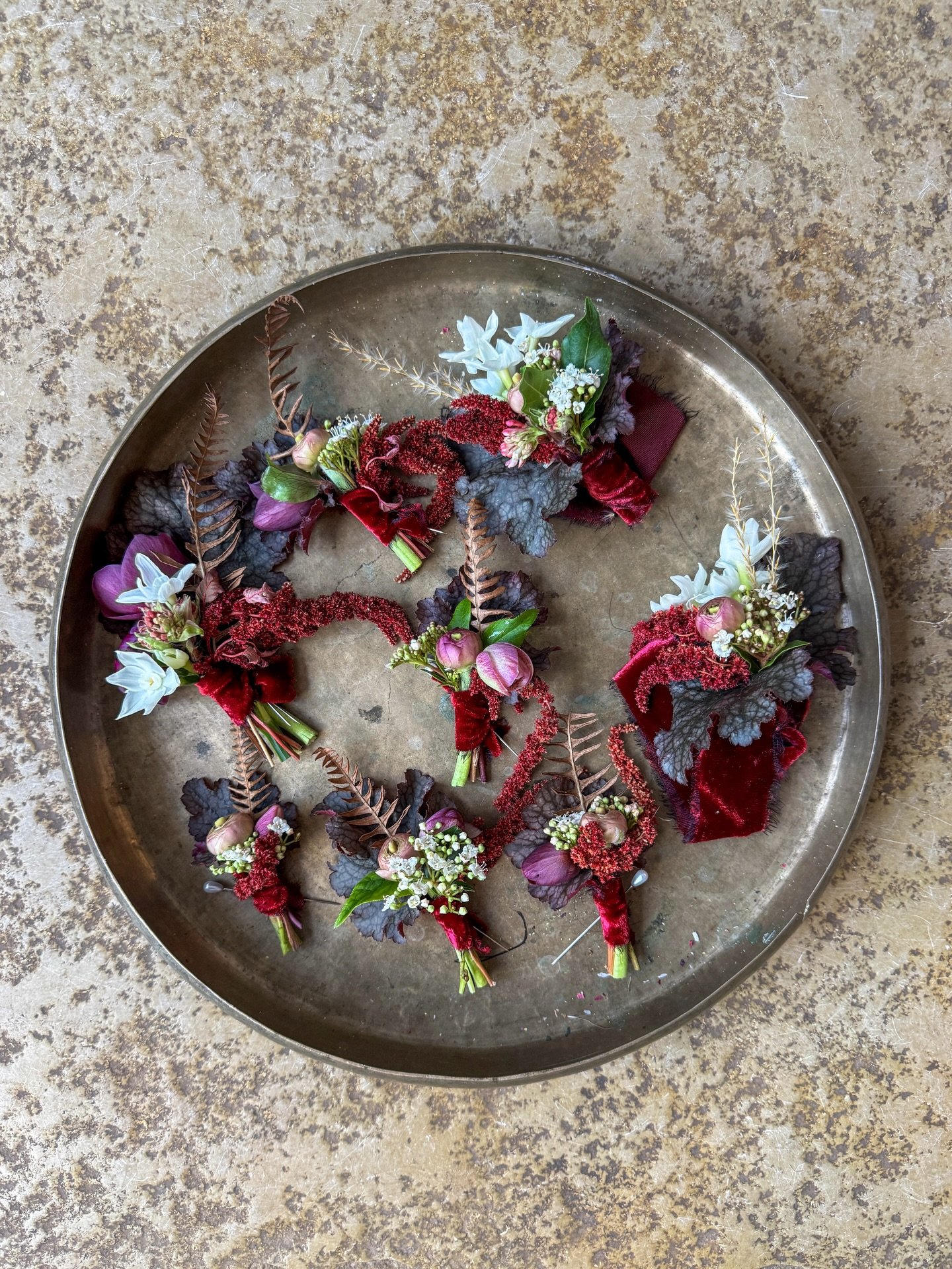 Buttonholes &amp; corsages from E&amp;R&rsquo;s wedding at @aswarbyrectory.

Dark, sumptuous romance with ranunculus, narcissi, hellebores, amaranthus, viburnum, bracken &amp; those beautiful deep purple heuchera leaves. 

Finished with the gorgeous 