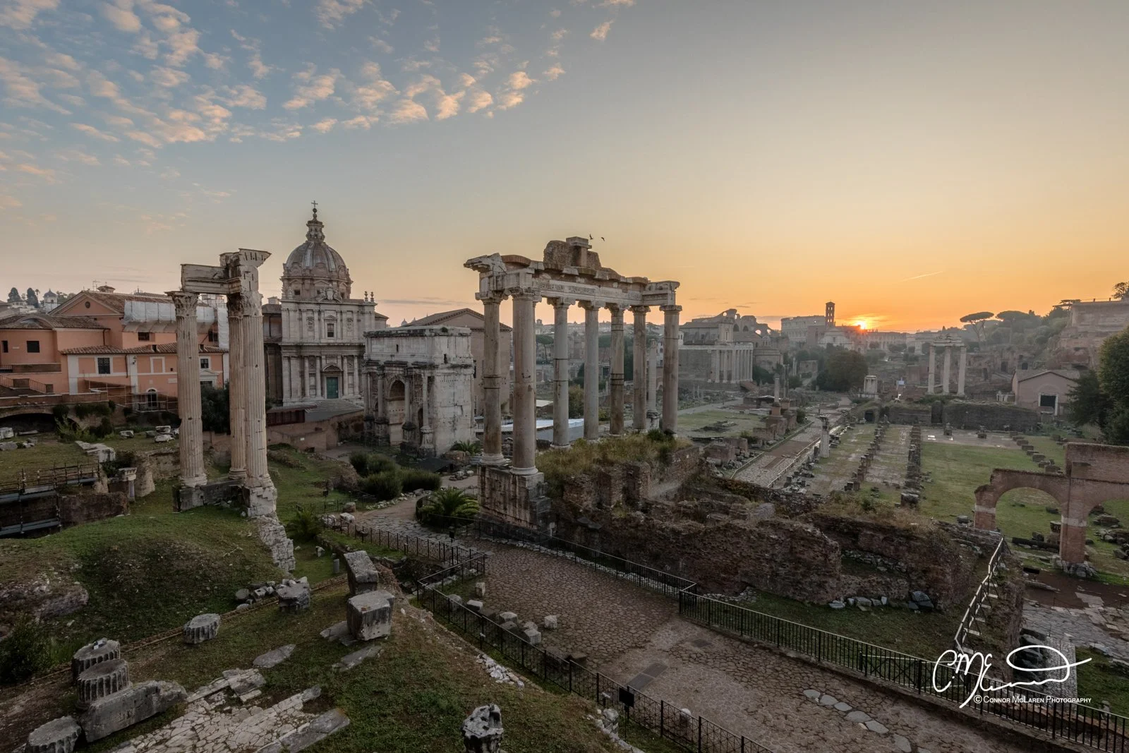Roman Forum, Rome & the vatican. Ancient ruins of a historical site during sunset, with classical columns and remnants of buildings.