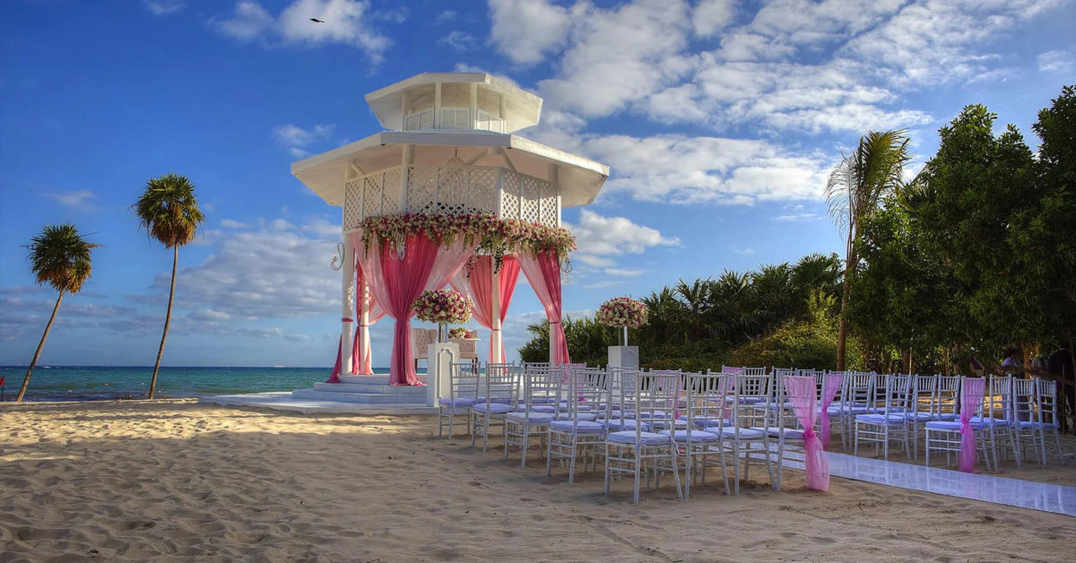 White Beach Gazebo wedding venue at Paradisus Playa del Carmen with Kanna Bridge in the background