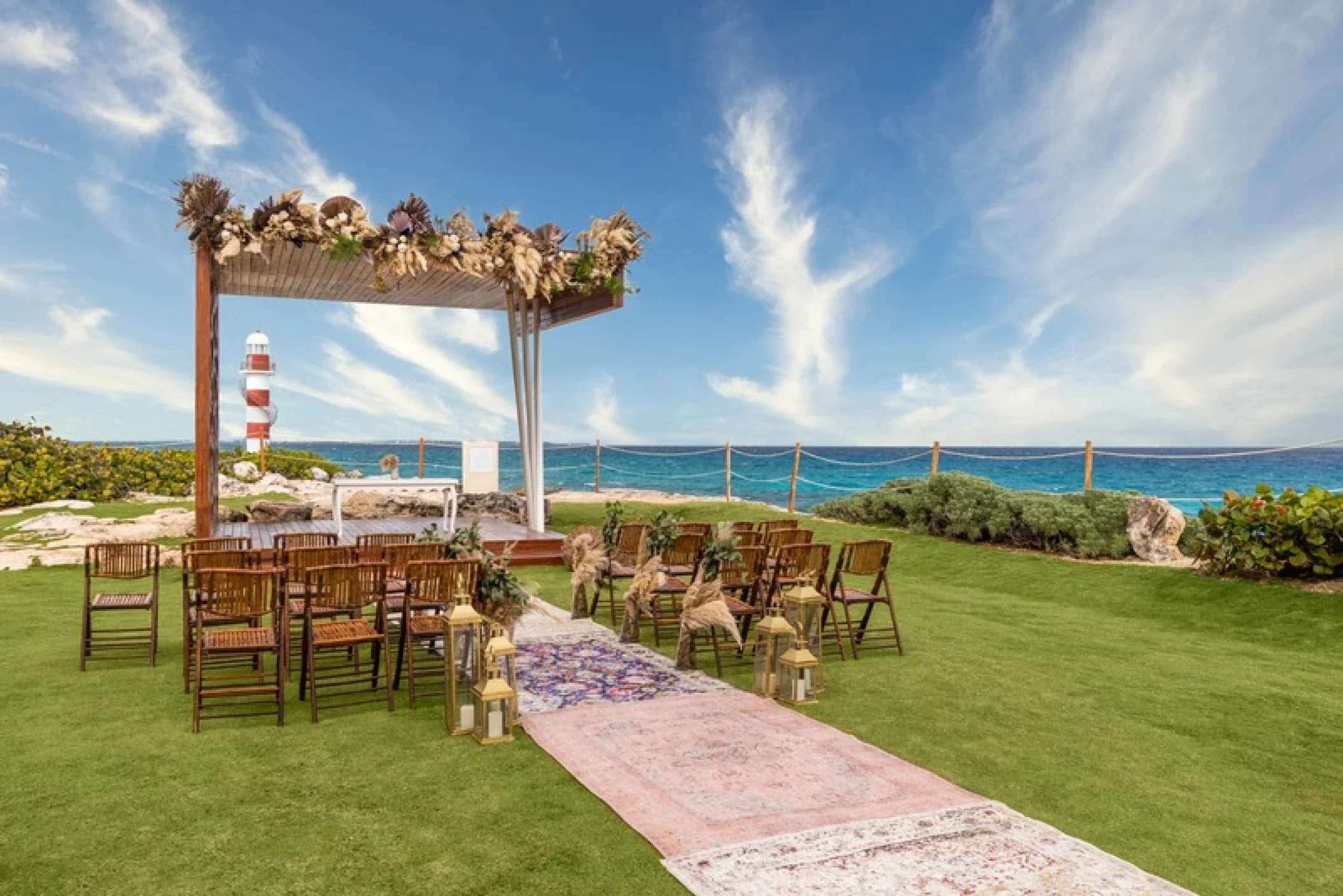 Lighthouse Gazebo wedding venue at Hyatt Ziva Cancun with the Punta Cancun lighthouse in the background