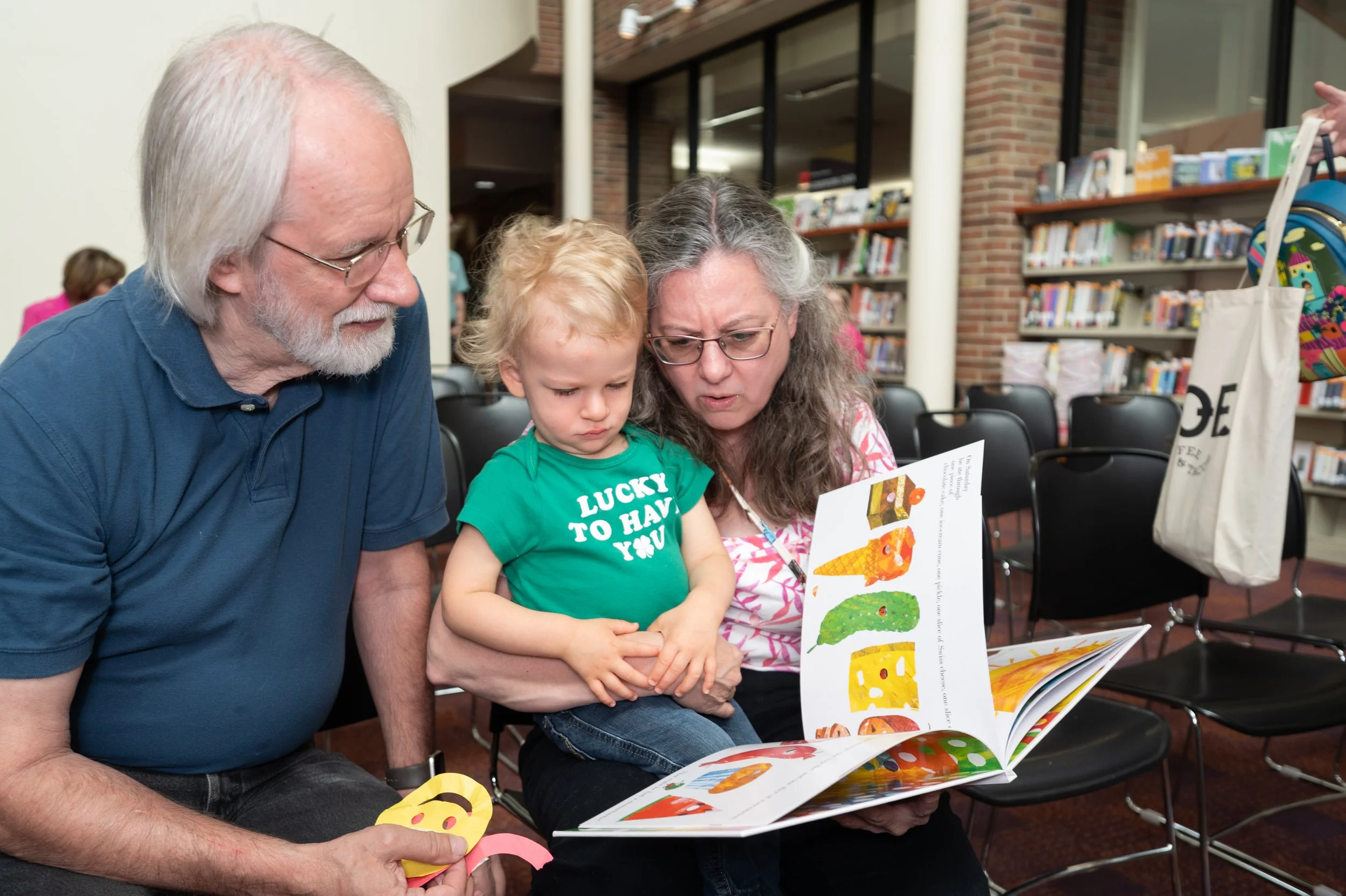 grandparents reading with child