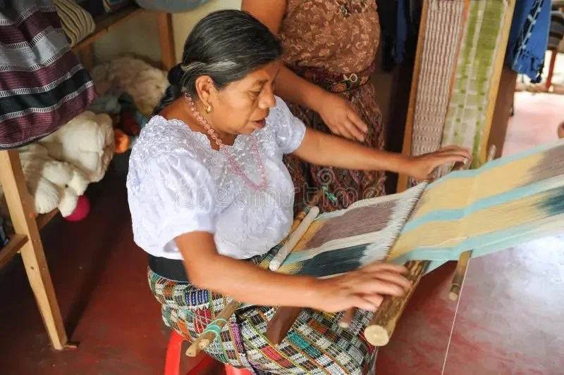 mayan-woman-weaving-yarns-san-juan-la-laguna-guatemala-40080010.jpeg
