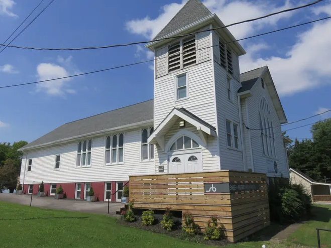 Former house of worship on Sutherland Avenue, which is now home to Smee + Busby Architects, stands amid a backdrop of a blue sky on July 1. John Shearer/Shopper News