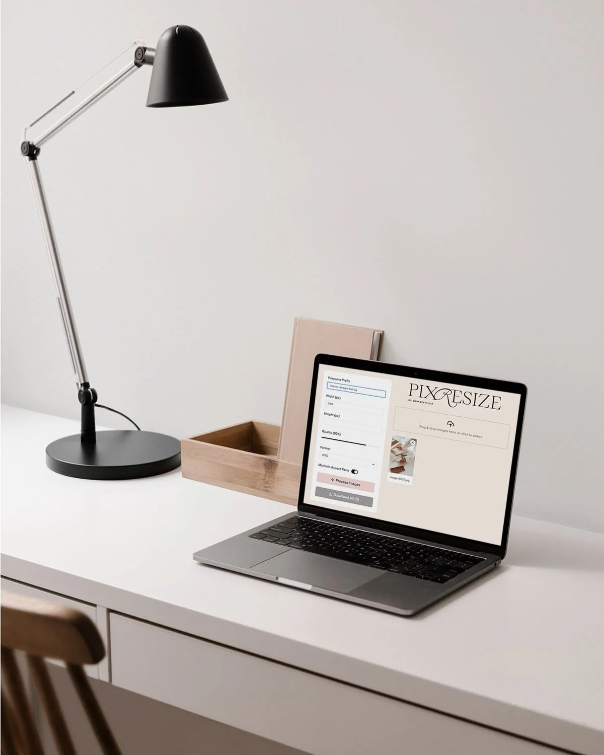 Laptop on minimal desk showing the website for PixResize tool