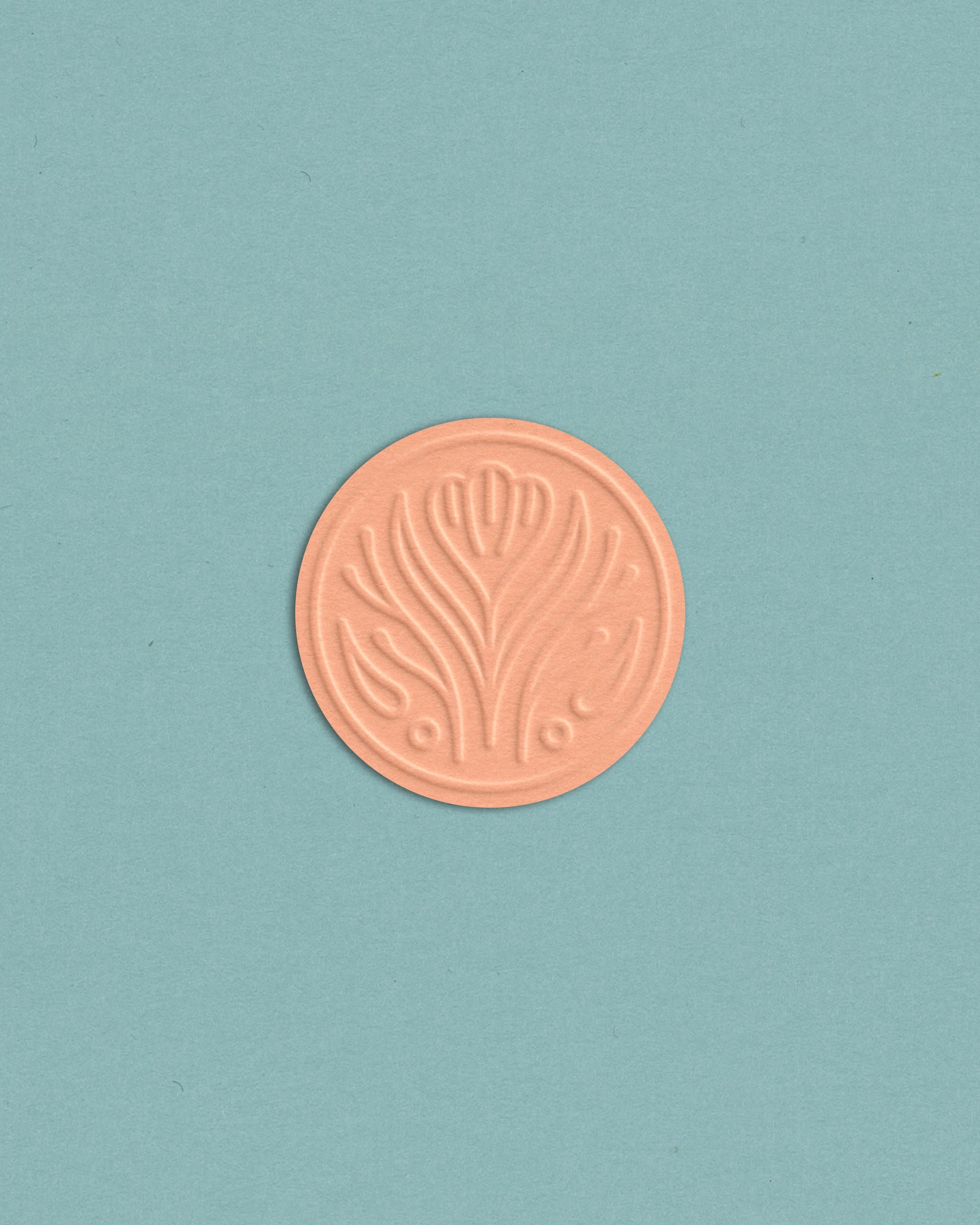 a modern, sea-inspired logo designed by Akula Kreative, shown as an embossed sticker mock-up in melon and blue / akulakreative.com