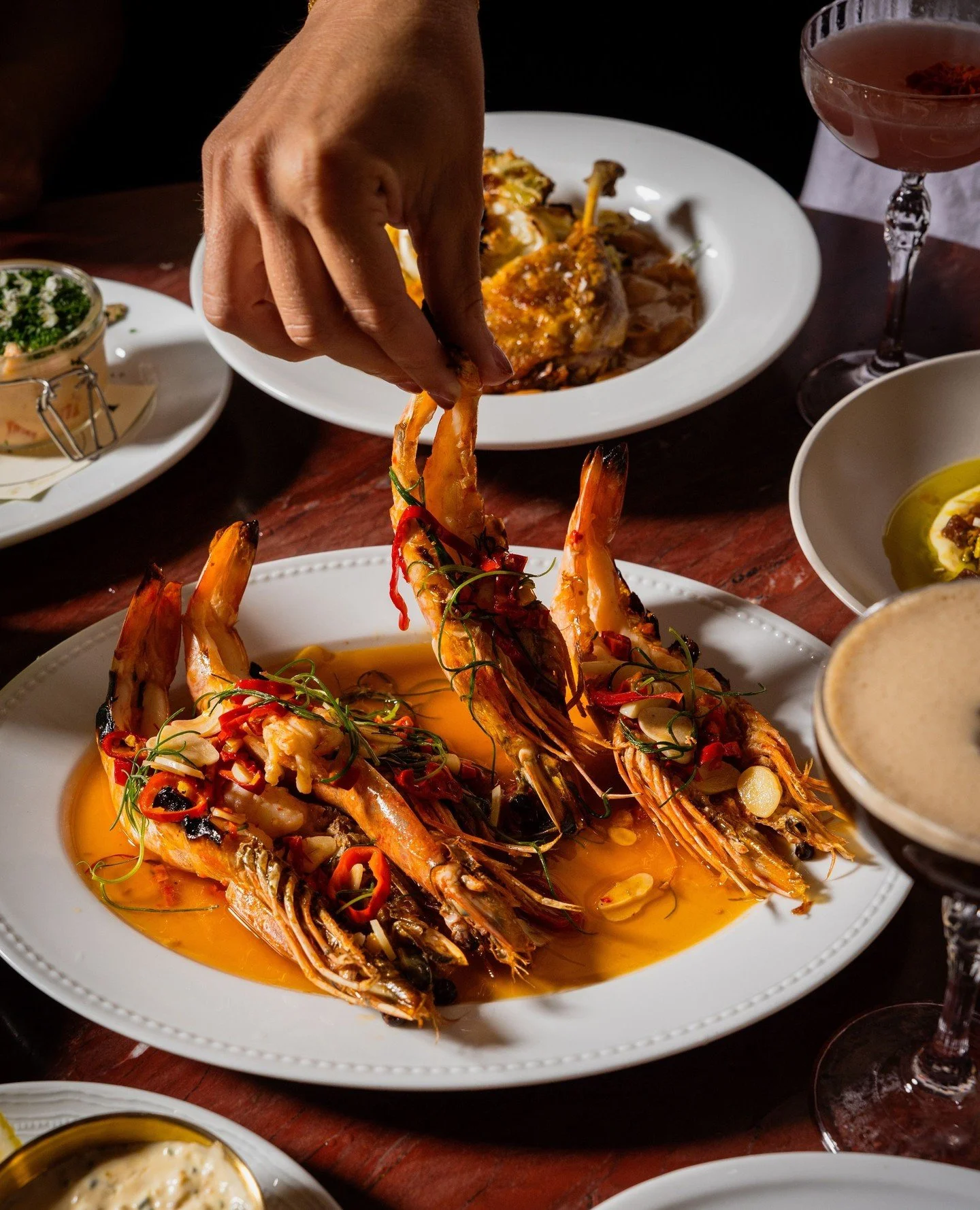 Real ones know the best part&rsquo;s in the head. Colossal Prawns with jimmy nardello pepper, yuzu, and garlic aioli.