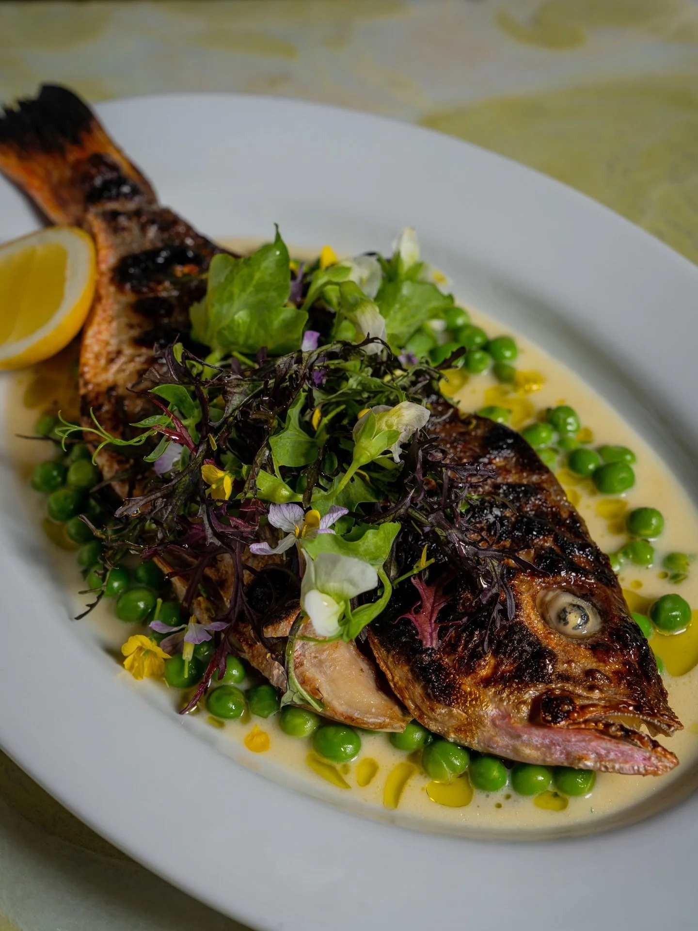 Inspired by one of Chef Tara&rsquo;s childhood favorites, crispy fried fish, our Ros&eacute; Snapper pairs a classic French beurre blanc with calamansi for a bright, citrusy balance.