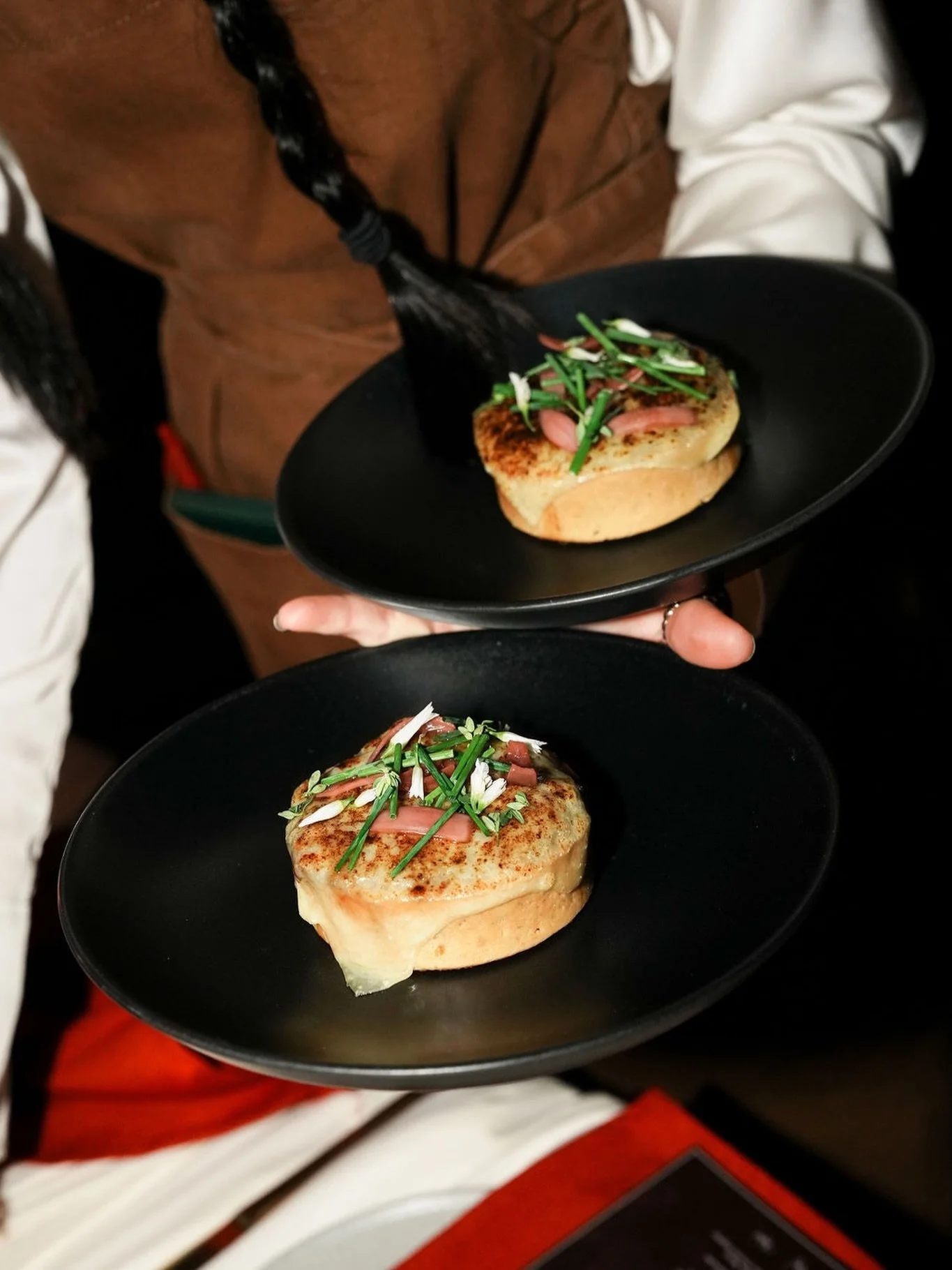 Everything you love about French onion soup, reimagined as a tart. Tender shredded short rib, deeply caramelized onions, melted Gruy&egrave;re, and rich beef stock poured tableside.
