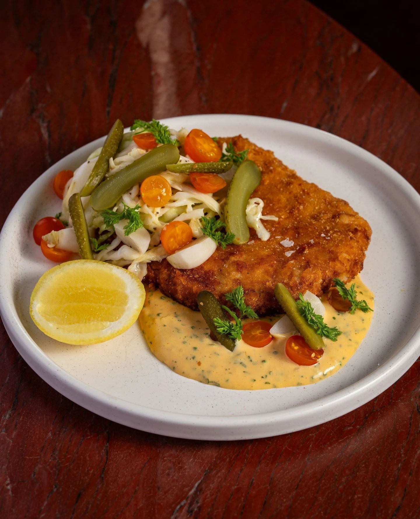 No meat, no problem. Our Vegetable Katsu takes its cues from a dim sum turnip cake, turnip, green papaya, and kohlrabi fried crispy, served with creamy cabbage slaw, pickles, and a French remoulade. The table will fight over this one.