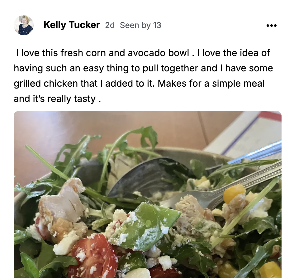 Fresh corn and avocado bowl with arugula, tomatoes, feta and grilled chicken.