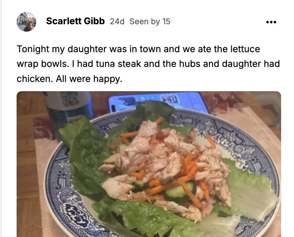 Chicken and carrot lettuce wrap bowl in a blue and white patterned bowl.