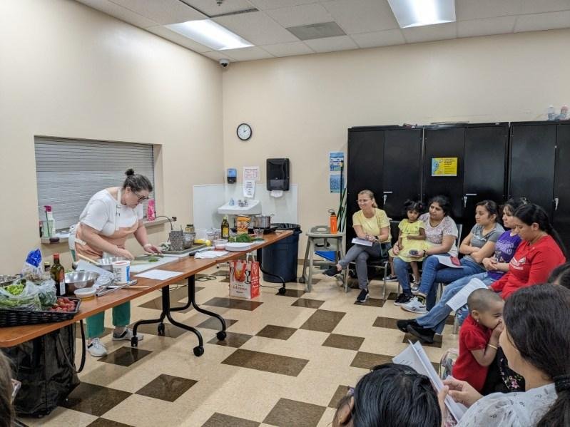 woman teaching in front of group