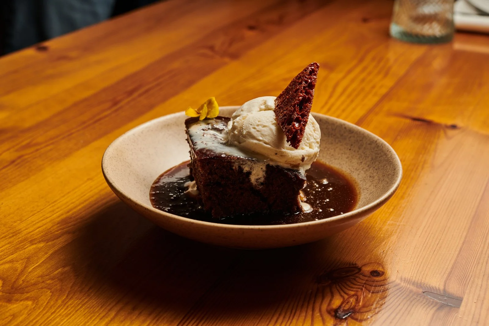 Sticky toffee pudding with toffee sauce, honeycomb and bourbon vanilla ice cream