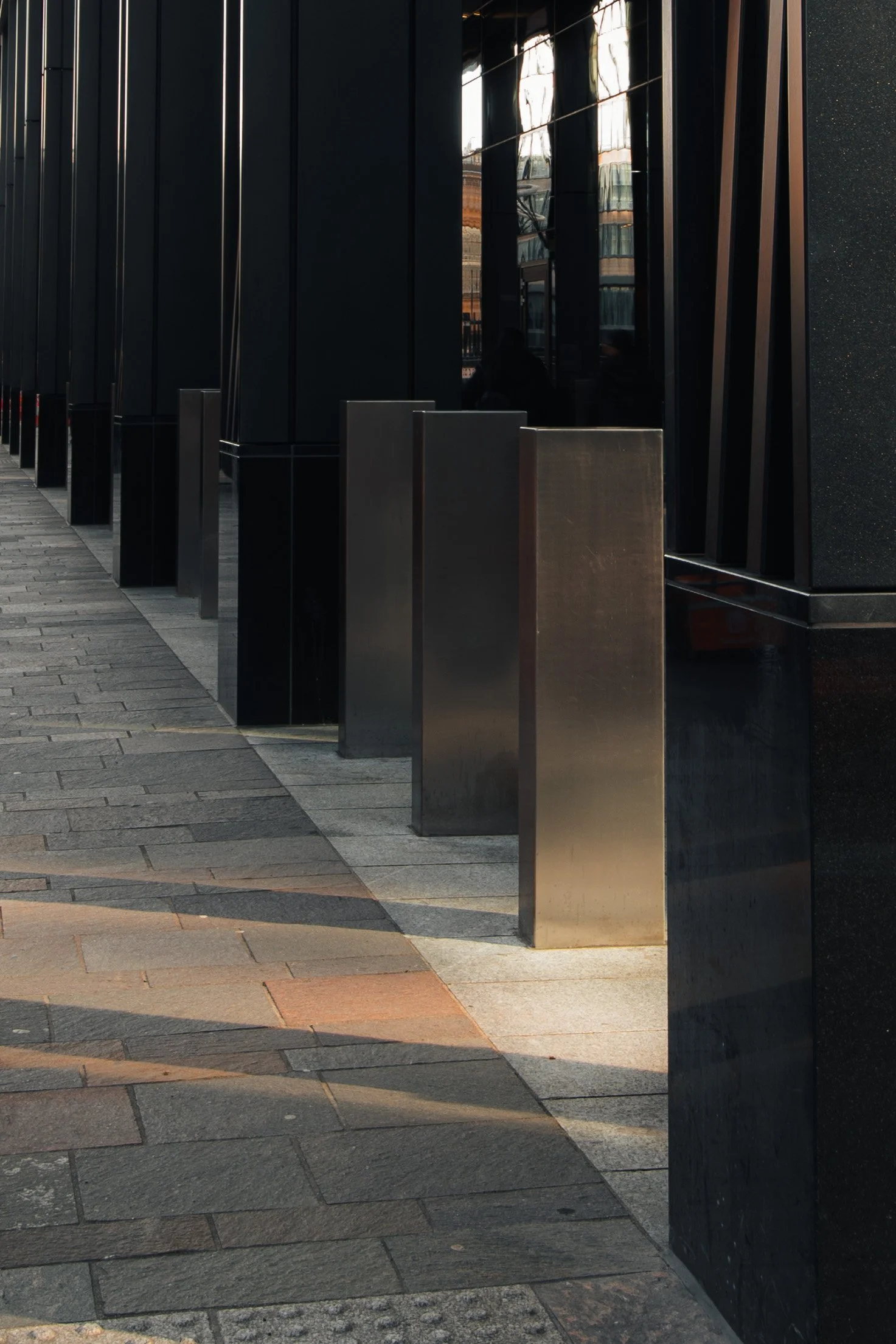 Close-up of stone column at JP Morgan building highlighting structure and material quality.