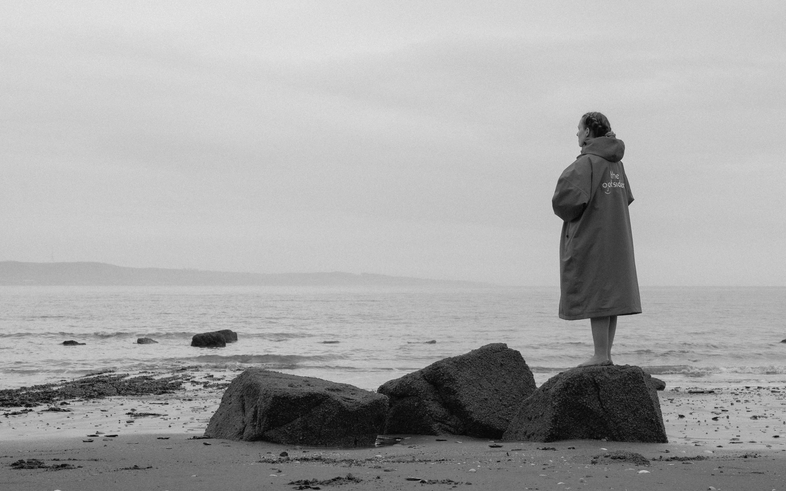 Close-up of The Ootsider jacket fabric showing texture, craftsmanship and functional design in natural light.