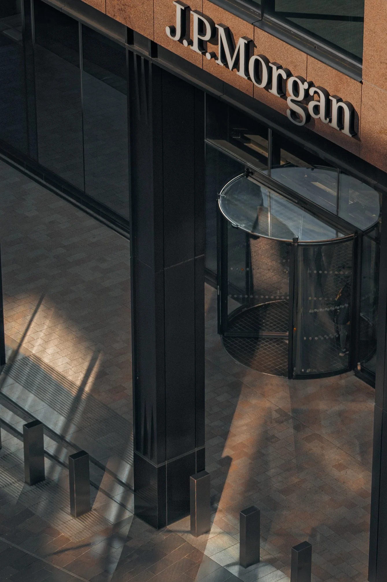 Stone façade detail at JP Morgan building focusing on material tone and craftsmanship.