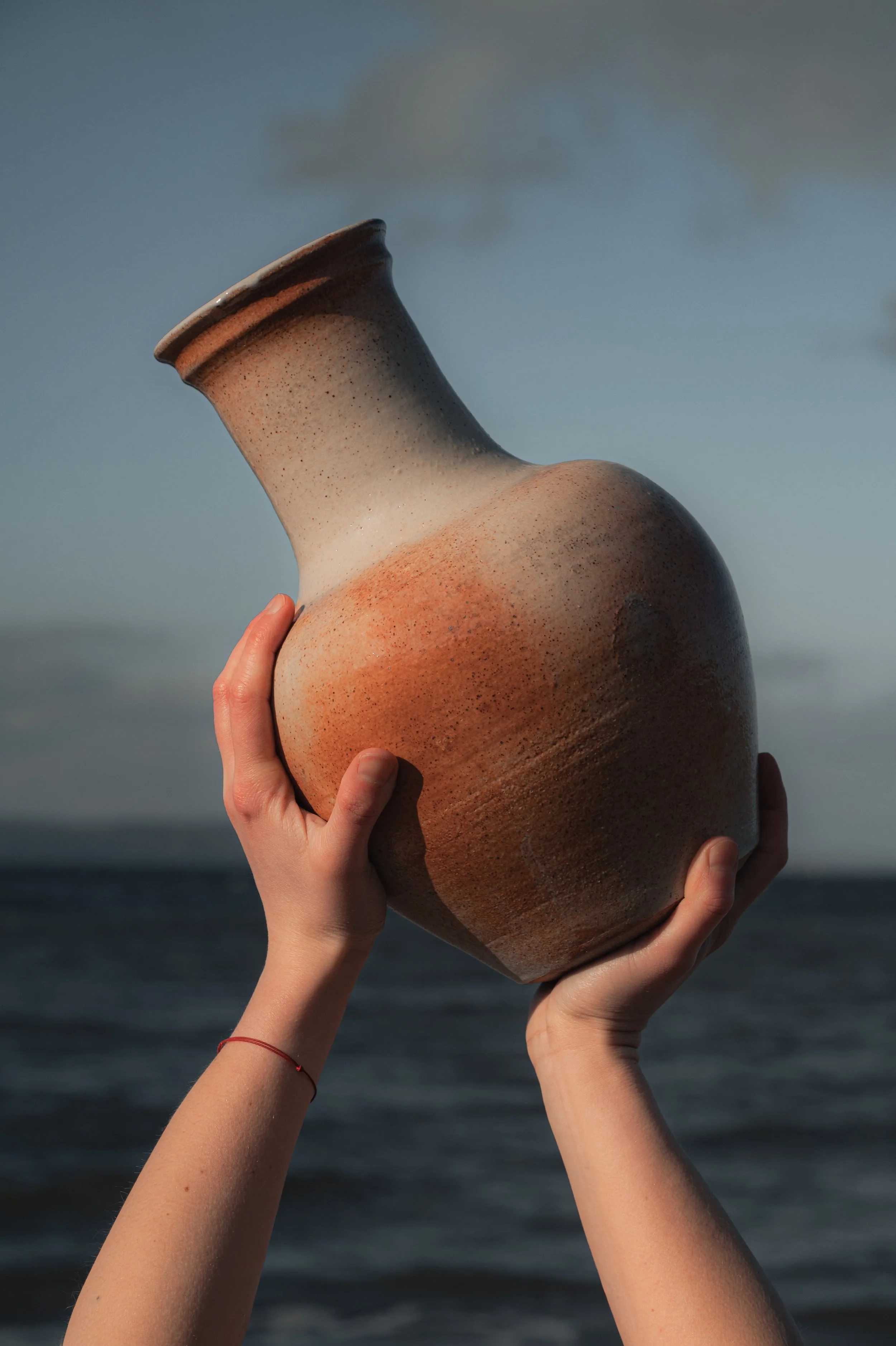 Handmade ceramic mug photographed in studio light.