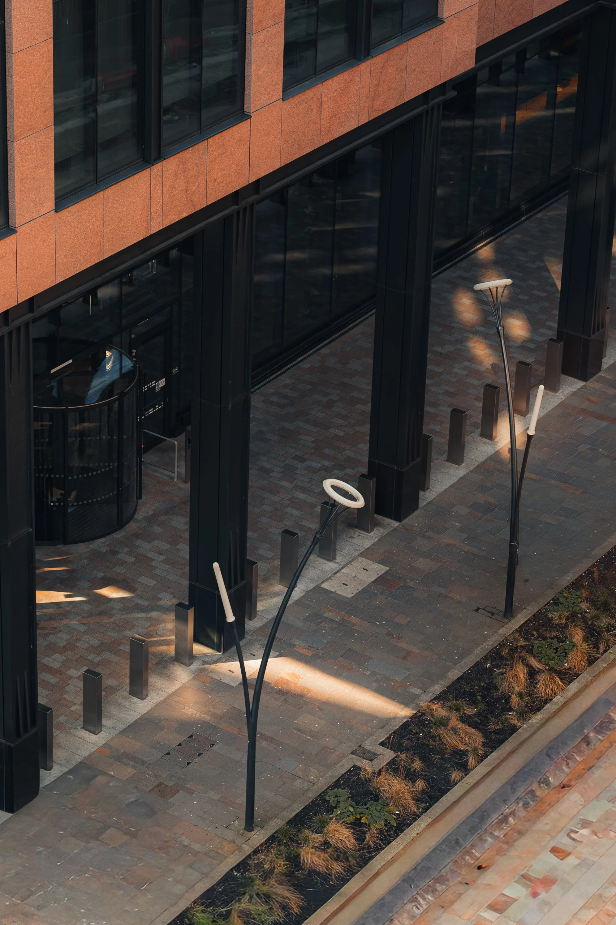 Close-up of black stone façade detail at JP Morgan building highlighting texture and material finish.