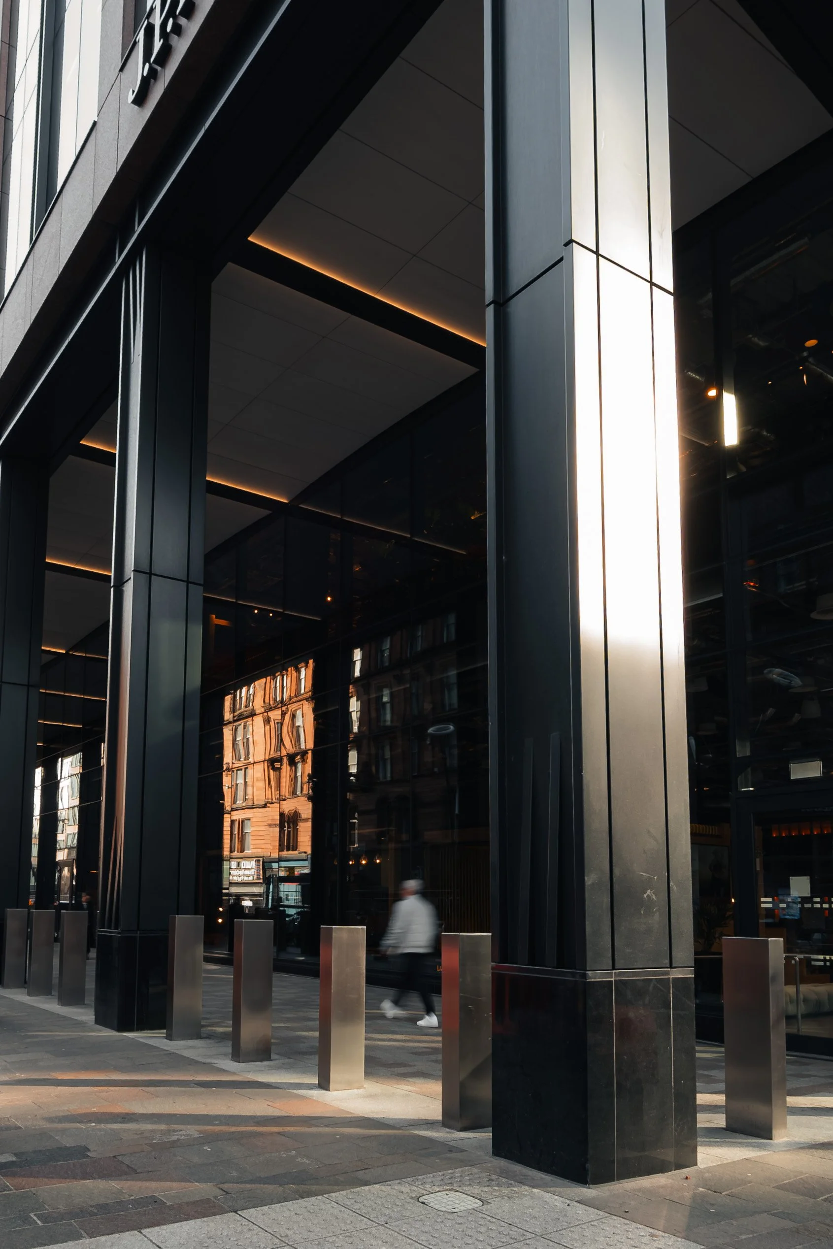 Black stone detail from JP Morgan building in Glasgow showing natural texture and finish.