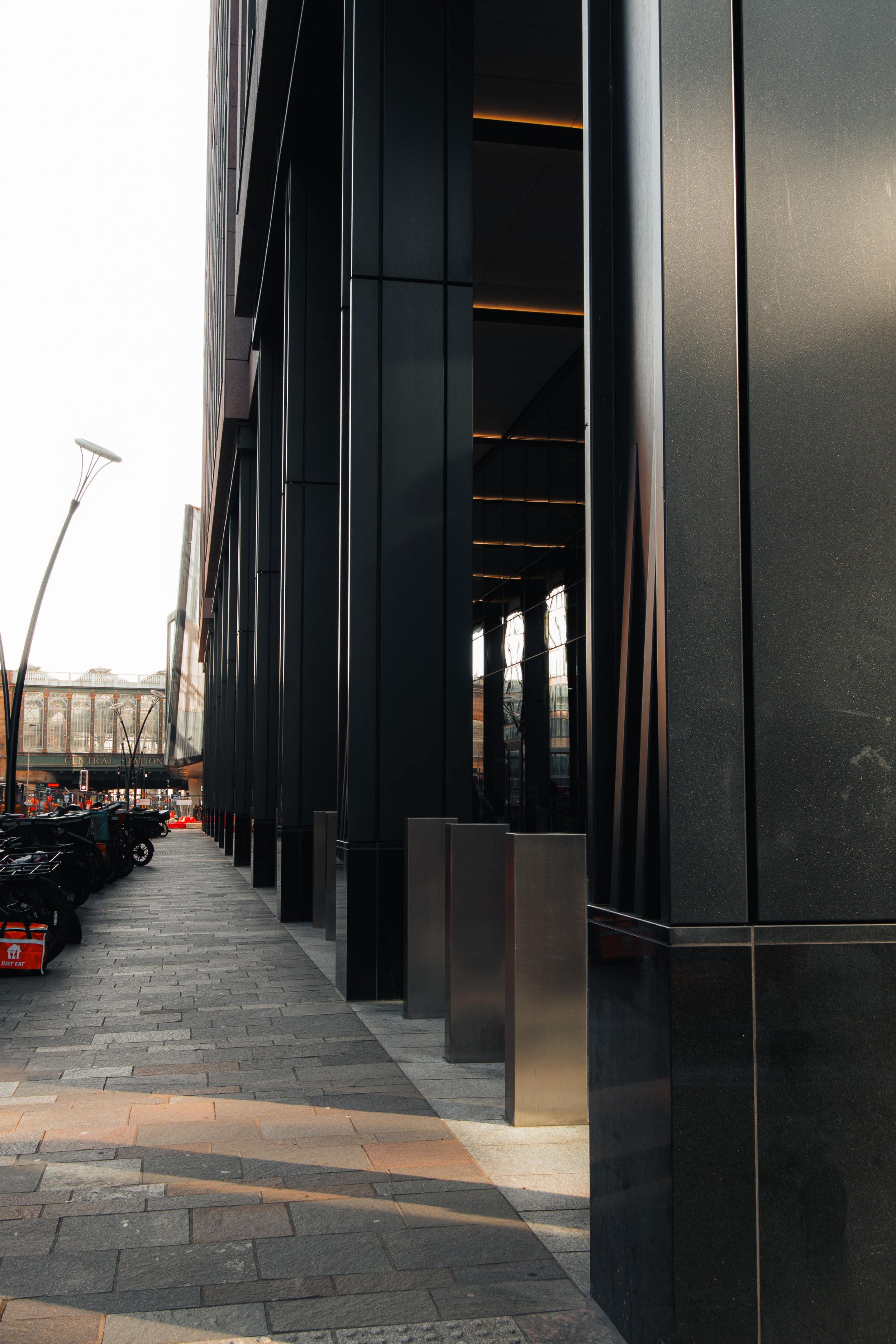 Architectural stone surface detail at JP Morgan building emphasizing material and design.