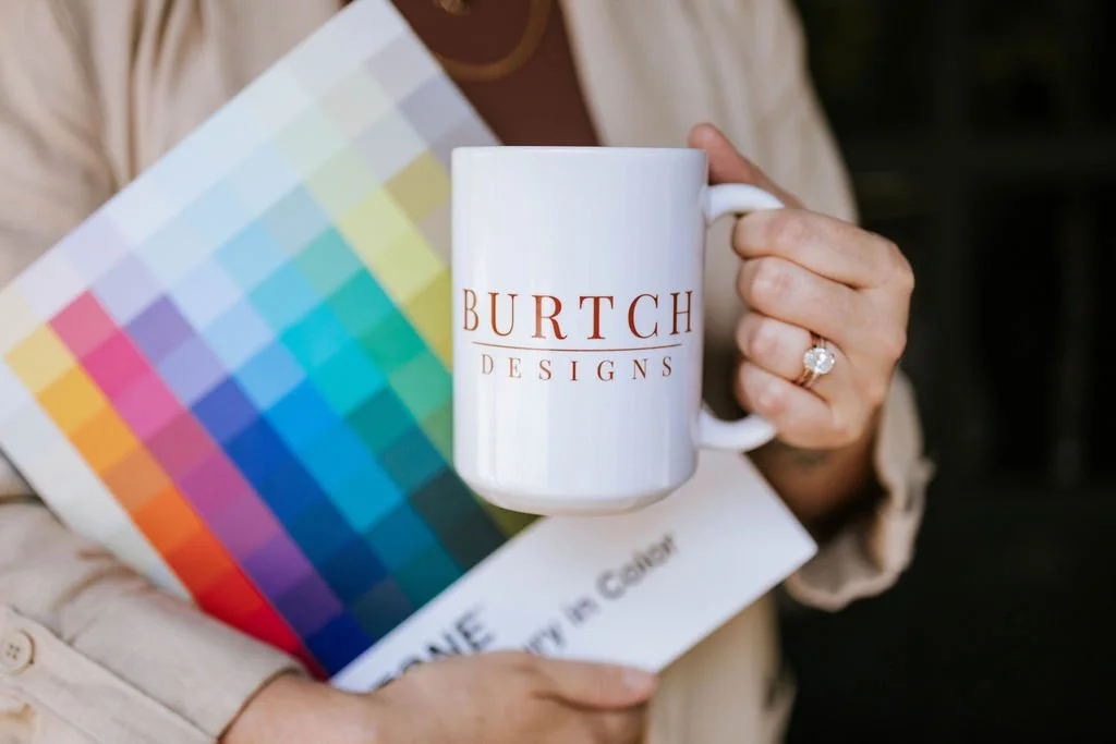 selecting powerful brand colors with a pantone book and a mug