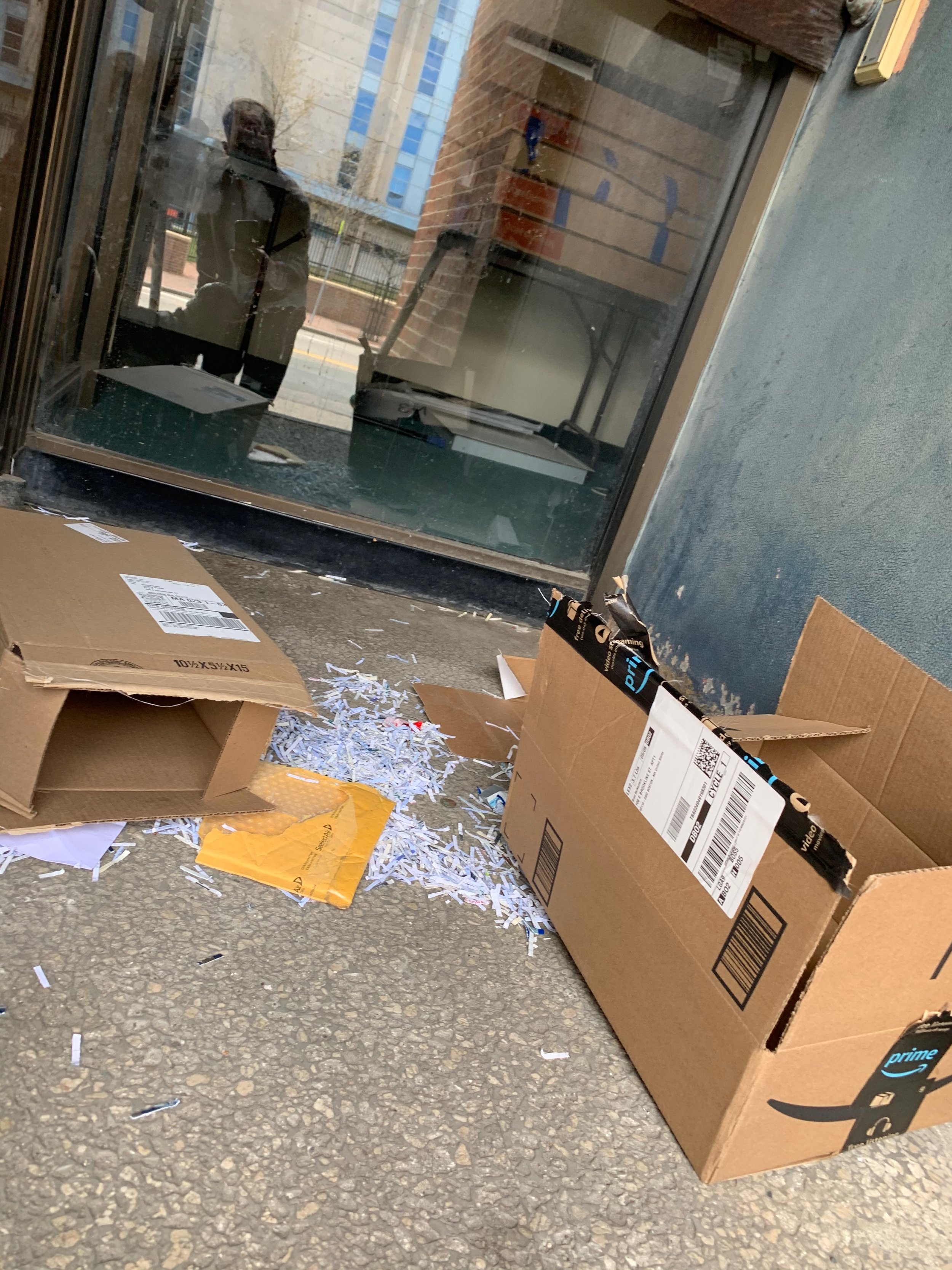 Torn-open packages bearing addresses of residents around the corner, Albany Street