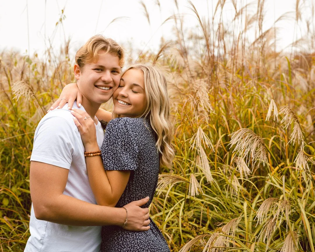 Couple hugging in field