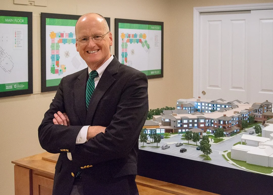 President leaning on model of future construction