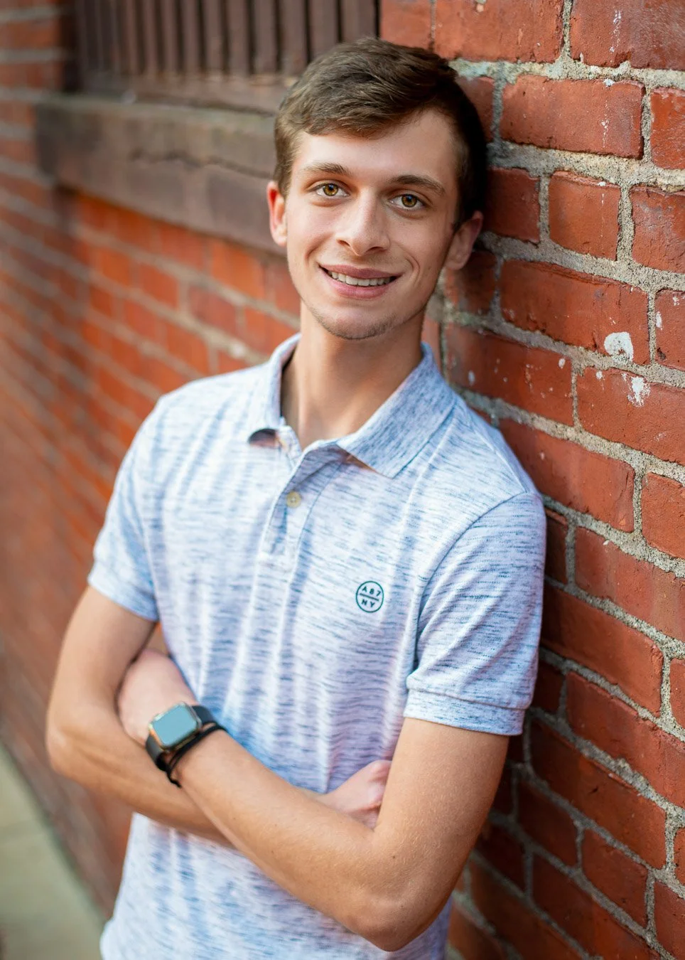Noah leaning on wall