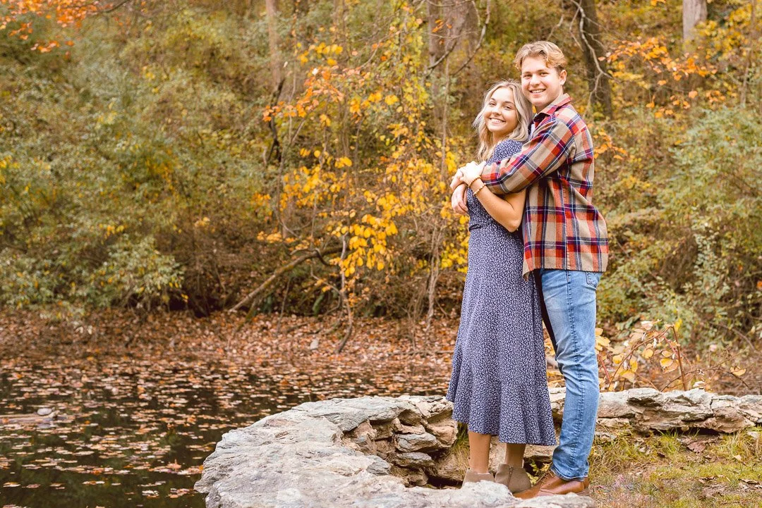 Couple hugging by pond