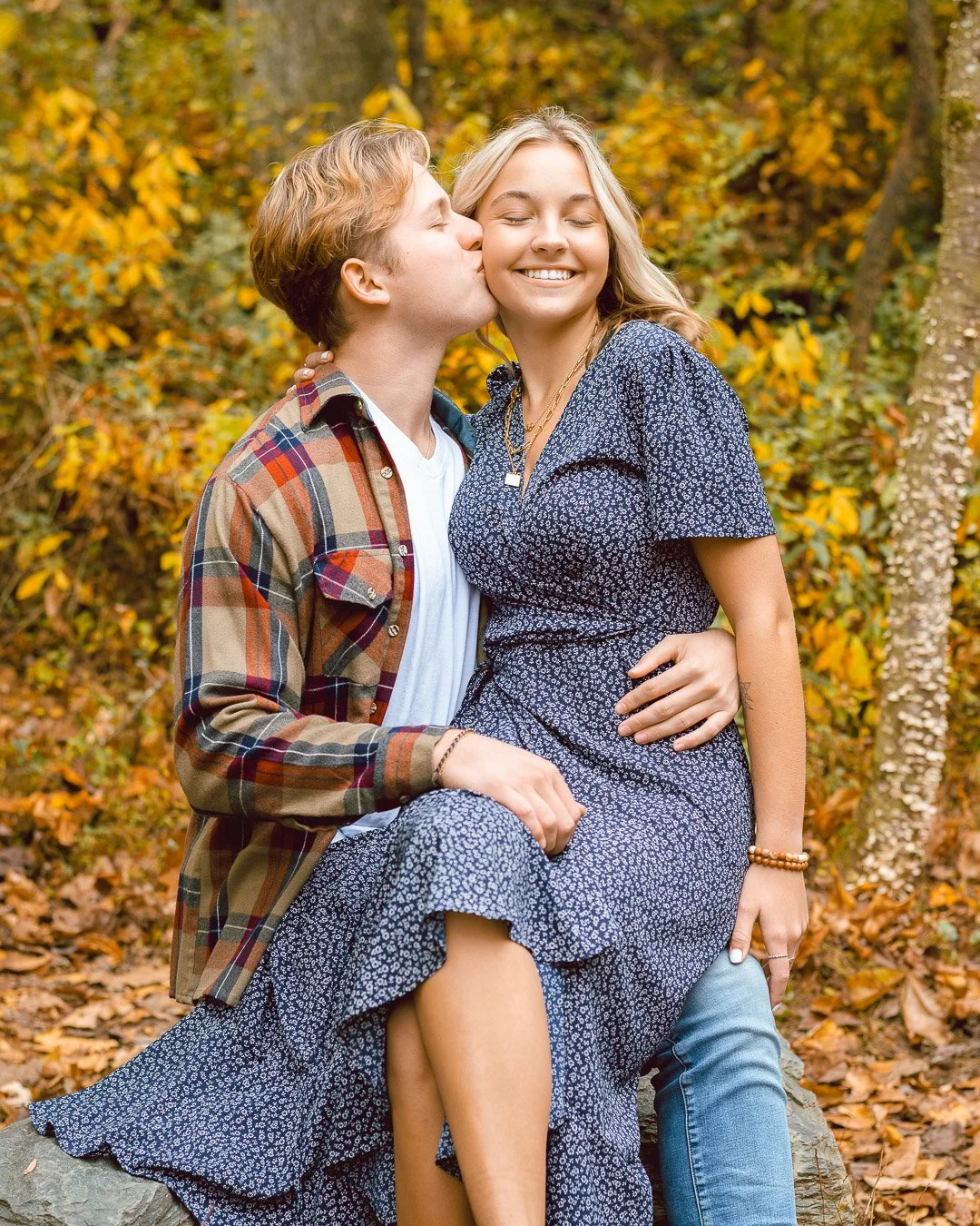 Couple sitting in woods