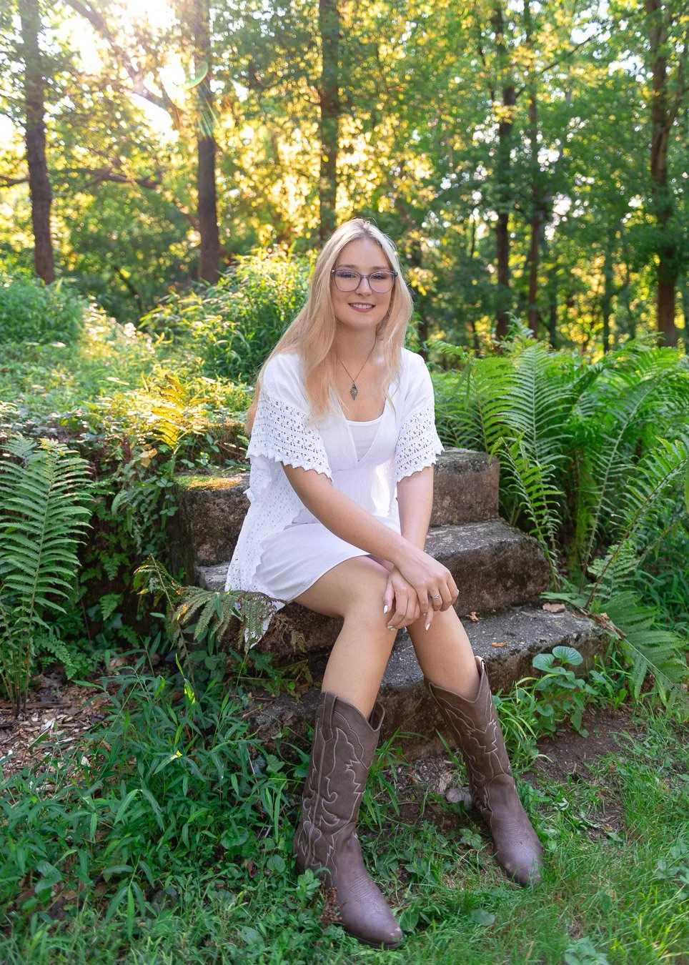 Ellie sitting in ferns