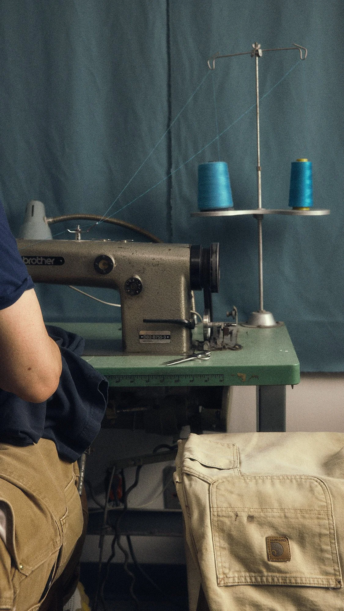 Industrial sewing machine process for Wylie Welling by Scorpion Rose Studio and Lafayette American. Highlighting authentic craftsmanship and heavy-duty apparel construction.