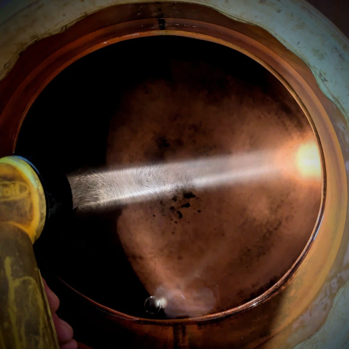 Our still is a traditional copper alembic design and does not include any sophisticated Clean-in-Place (CIP) systems which automate the cleaning process. 
So, all cleaning is done manually, by hand, after every distillation.
The reward justifies the 