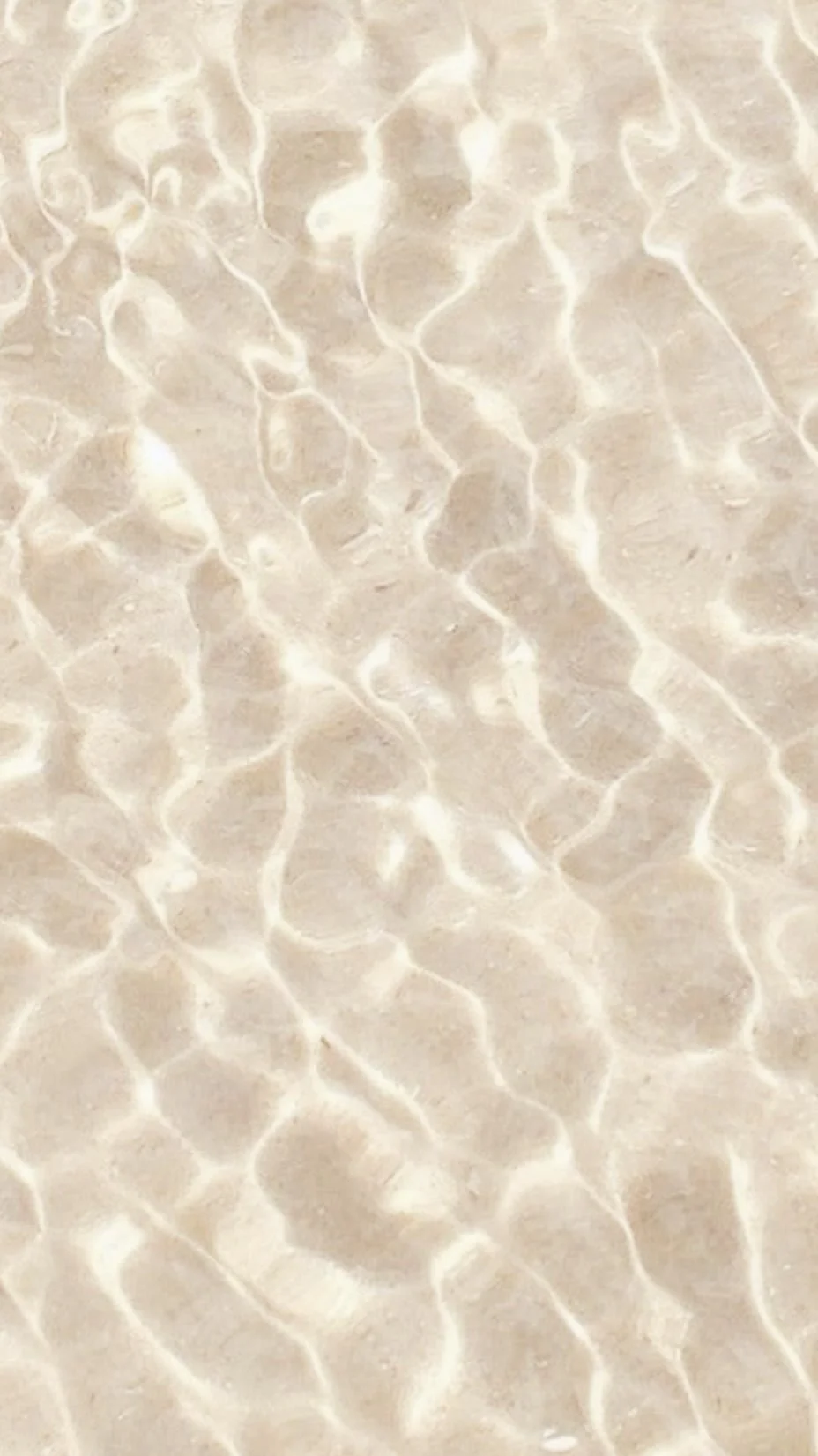 Close-up of a clear, rippled water surface with sunlight reflecting off it, creating a pattern of bright lines.