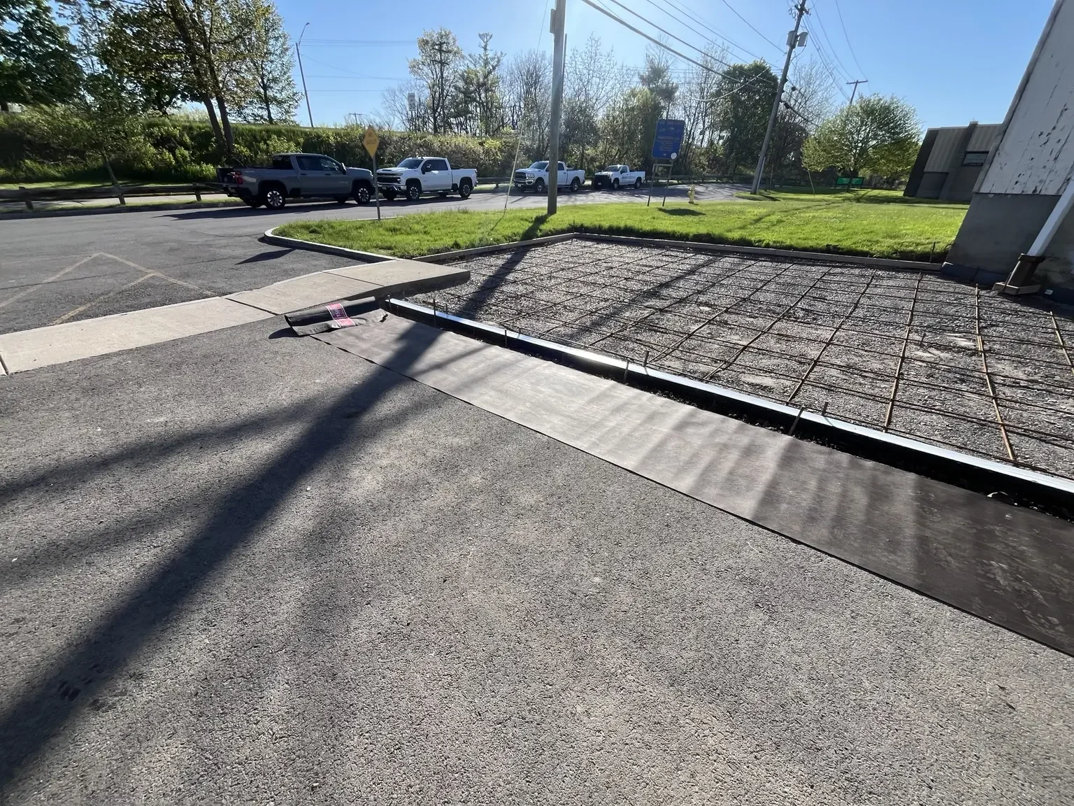 Steel reinforcement and channel-drain preparation for a commercial concrete parking area in Pittsford, NY
