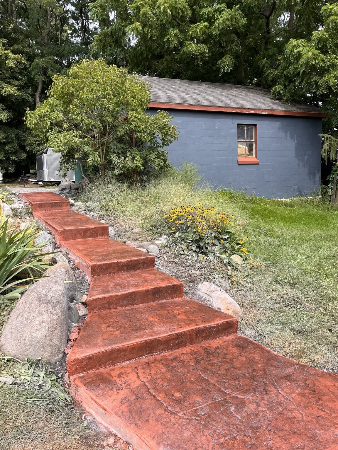 Slate-stamped concrete steps with smooth faces in West Henrietta, NY