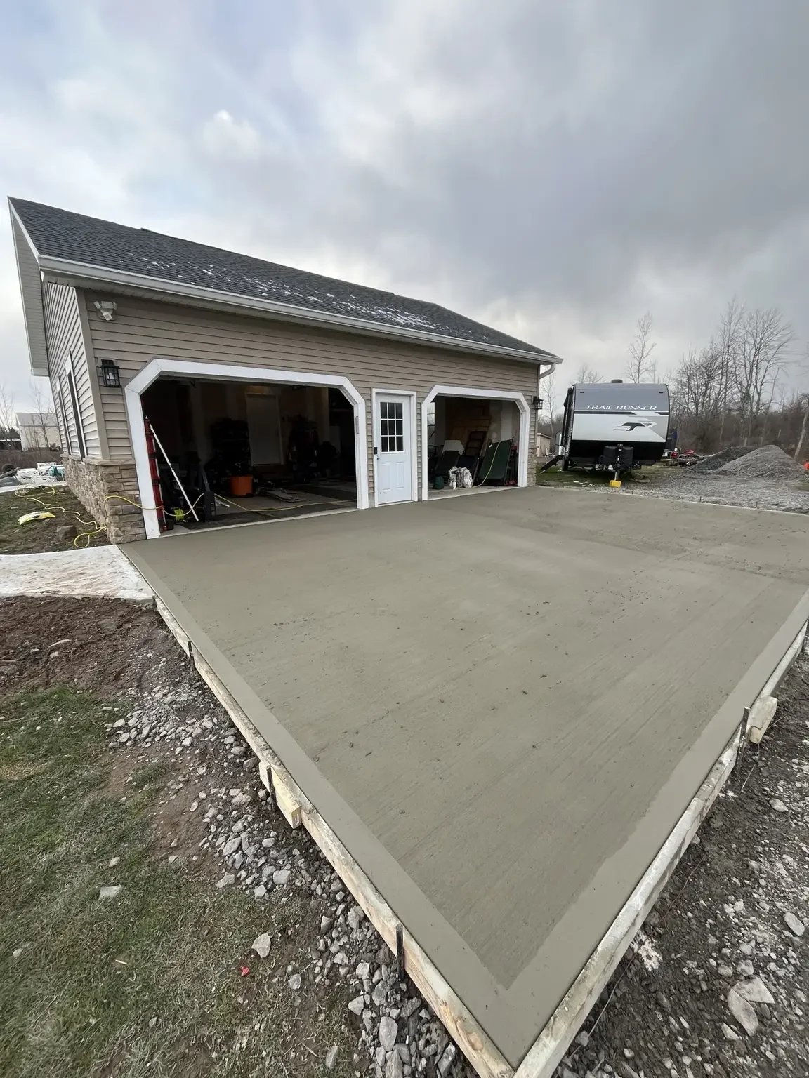 New concrete driveway and garage approach being installed at a Brockport, NY home