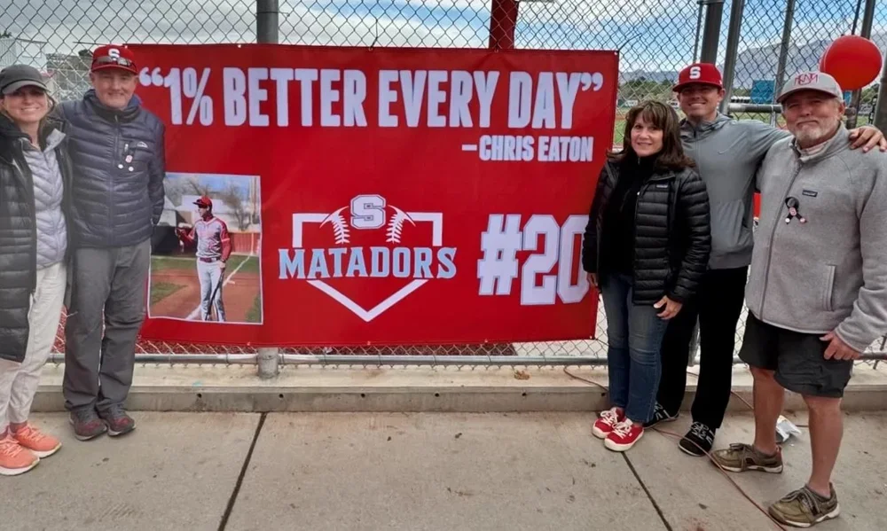 Sandia High baseball team presents outfield banner in honor and remembrance of Chris