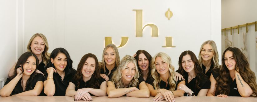 Phi staff members smiling in a horizontal image
