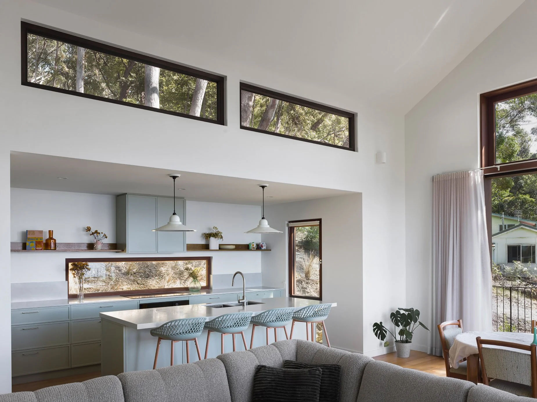 Modern Australian open-plan living area with electric floor heating by P.A.P. Heating Solutions