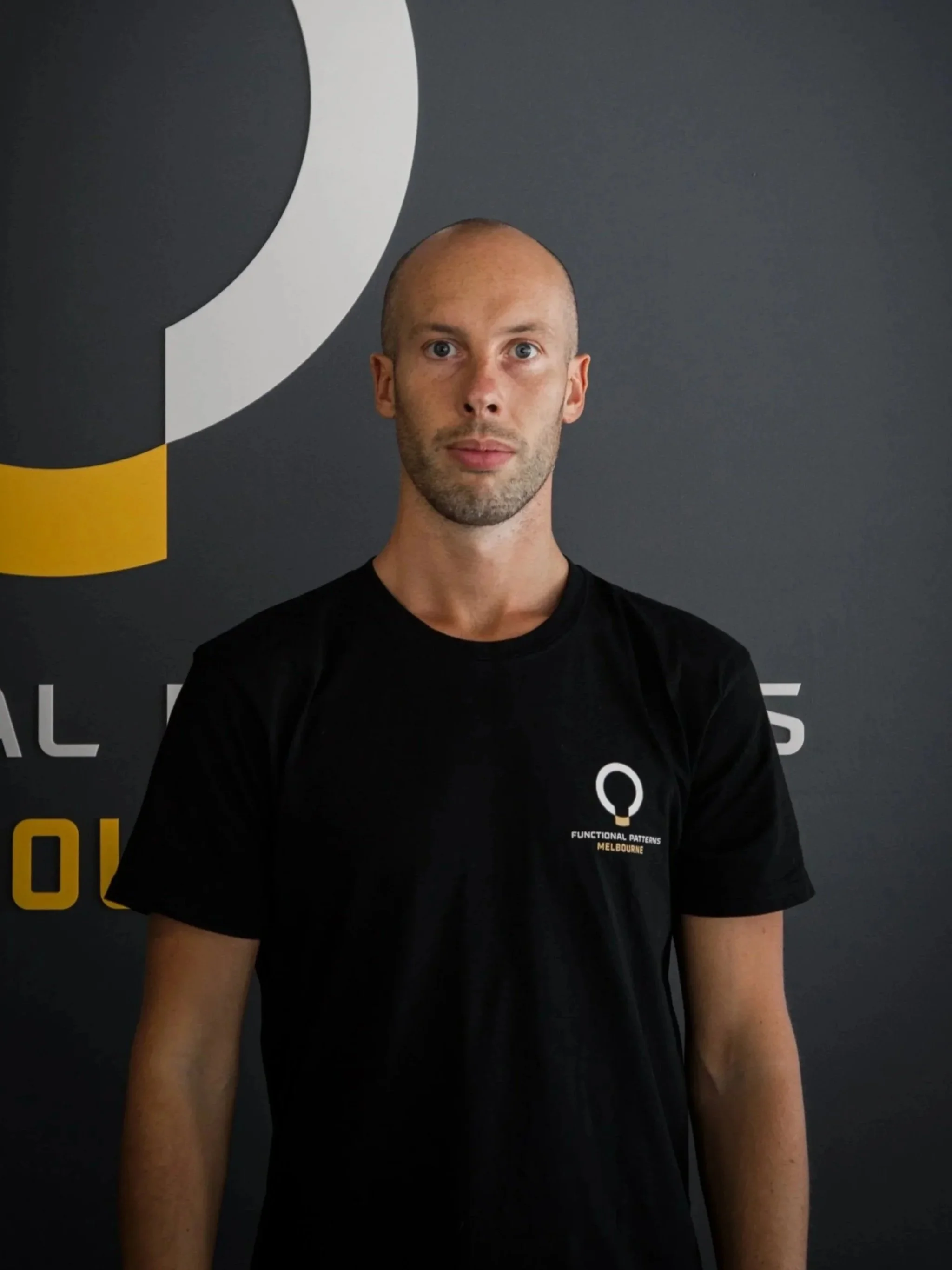 Filippo T. Busa, Human Biomechanics Specialist at Functional Patterns Melbourne, demonstrating movement assessment and posture correction techniques to improve functional movement and reduce chronic pain.