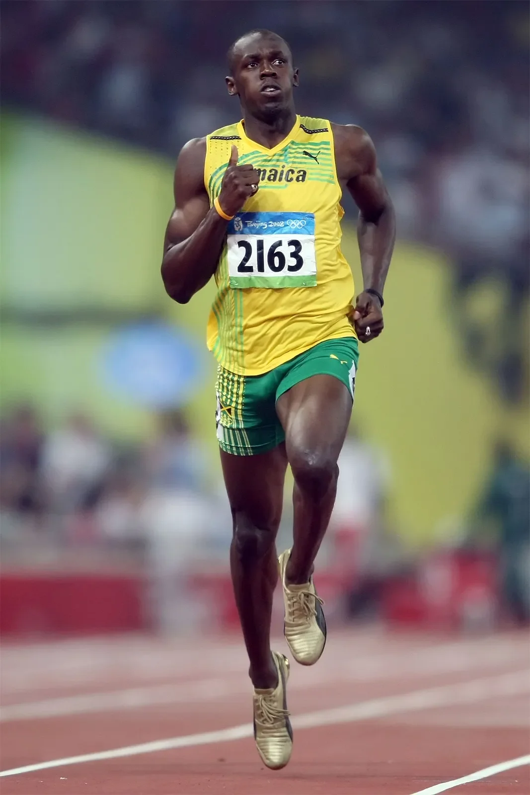Usain Bolt sprinting at full speed, exemplifying efficient biomechanics, posture, and movement patterns taught in Functional Patterns to improve athletic performance and prevent injuries.