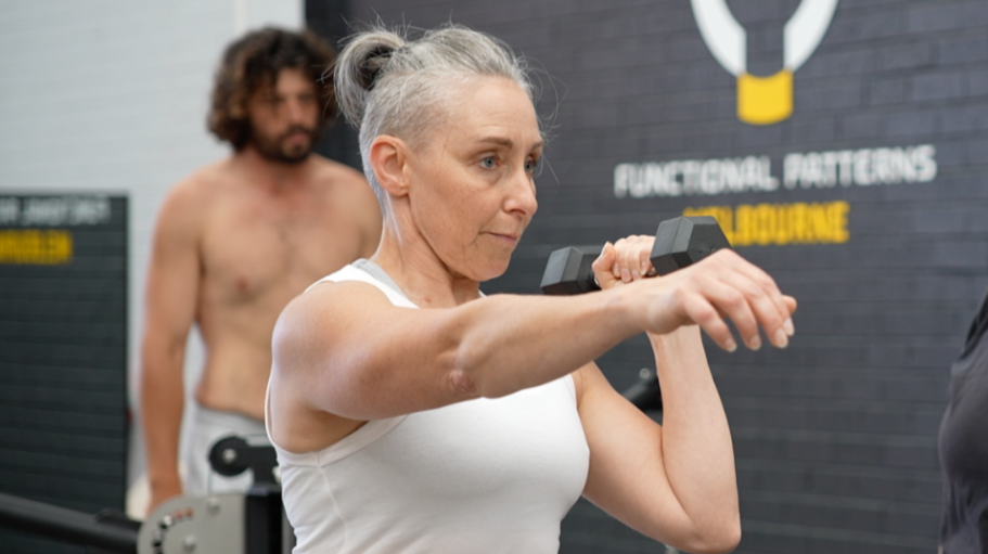 Functional Patterns Melbourne client training with a coach, improving posture, movement patterns, and overall functional fitness.