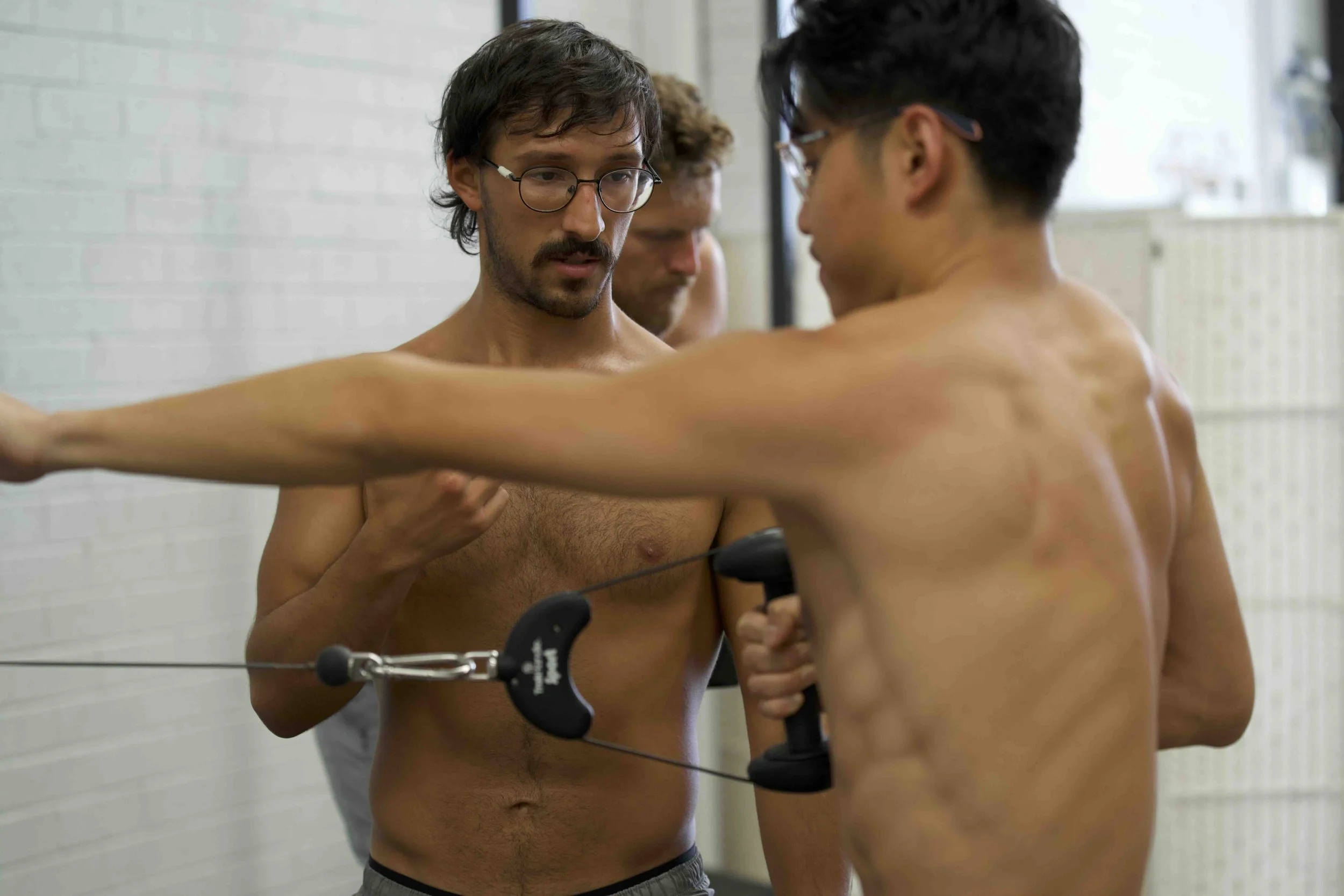 Participants improving posture and movement efficiency through Functional Patterns Human Foundations hands-on training