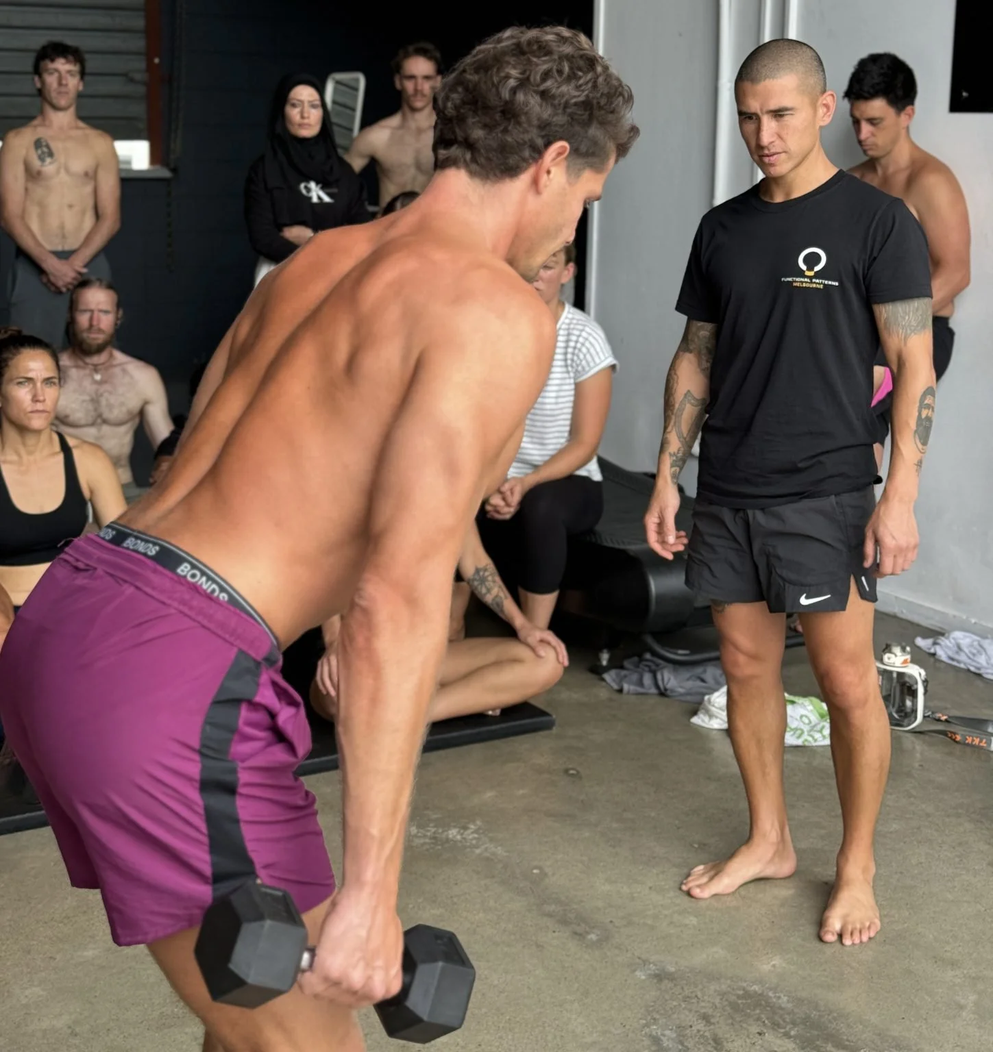 Participants practicing Functional Patterns movements in a hands-on Human Foundations certification course.