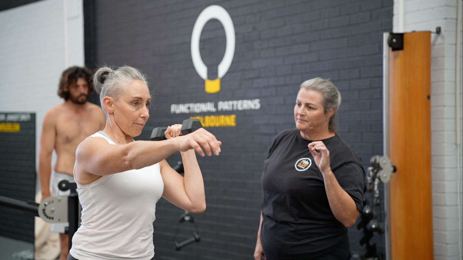 Client performing functional exercises at Functional Patterns Melbourne under trainer guidance, improving posture, movement patterns, and overall strength.