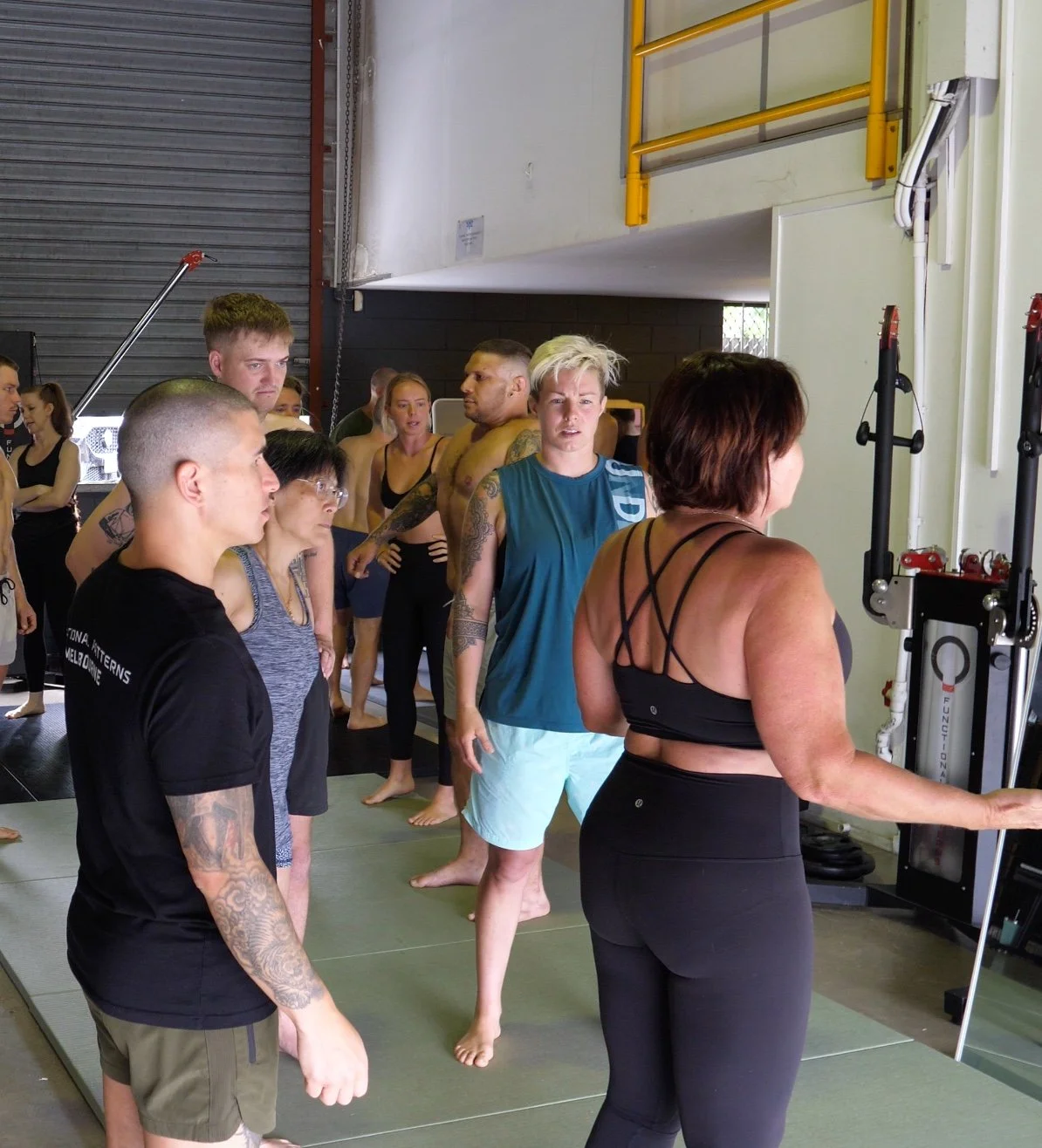 Trainers and participants practicing Functional Patterns corrective exercises during the Human Foundations Certification Course in Brisbane, Australia.